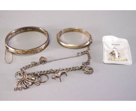 A collection of sterling silver jewellery to include: Two lockets & chains; Two pendant & chains; One baby bangle; One full b