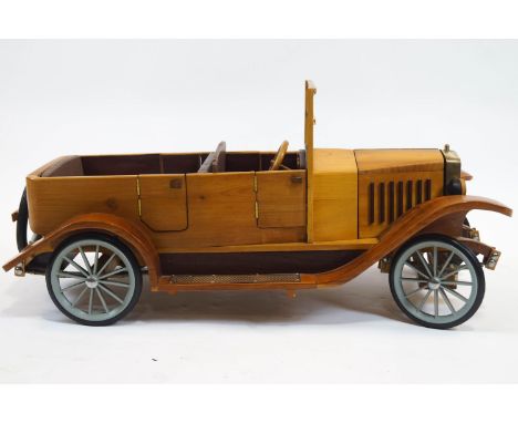 A wooden scale model of a Volvo 1927 OV4, with brass mounted front grille, 37cm high x 78cm long