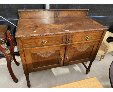 AN EARLY 20TH CENTURY OAK SIDEBOARD WITH RAISED BACK, ON BOBBIN TURNED LEGS, 42" WIDE 