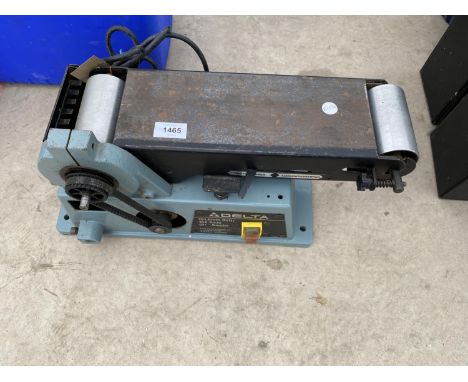 AN ELECTRIC DELTA BELT SANDER 