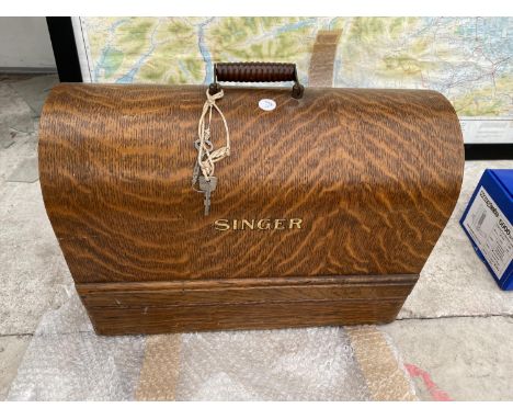 A VINTAGE SINGER SEWING MACHINE WITH WOODEN CARRY CASE 