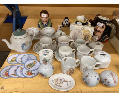 A COLLECTION OF PETER RABBIT CERAMICS TO INCLUDE LARGE TEAPOT, MONEY BOXES, POMANDERS, COASTERS, SOAP DISHES AND SOAP CUPS AN