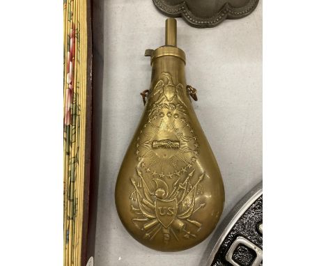 A VINTAGE BRASS POWDER FLASK WITH EMBOSSED USAND EAGLE TO FRONT AND REAR 