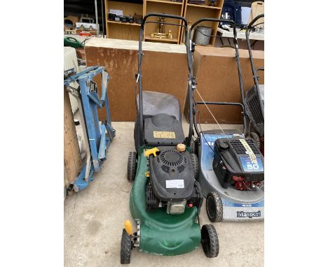 A PETROL ENGINE LAWN MOWER WITH GRASS BOX BELIEVED IN WORKING ORDER BUT NO WARRANTY 