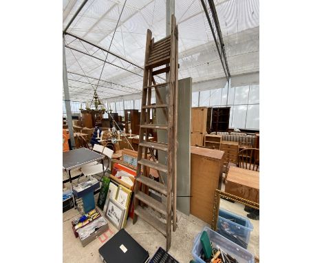 A VINTAGE EIGHT RUNG WOODEN STEP LADDER 