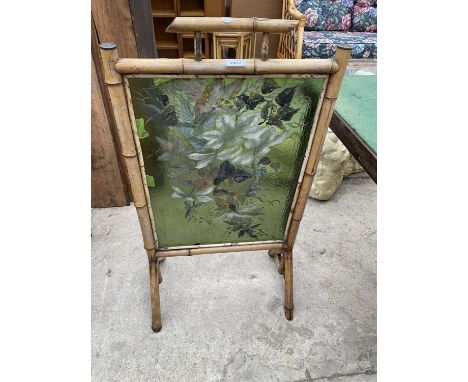A VICTORIAN BAMBOO FIRESCREEN WITH INSET FLORAL PAINTED GLASS PANEL 