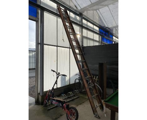 A TWO SECTION 28 RUNG EXTENDABLE LADDER WITH PULLEY SYSTEM 