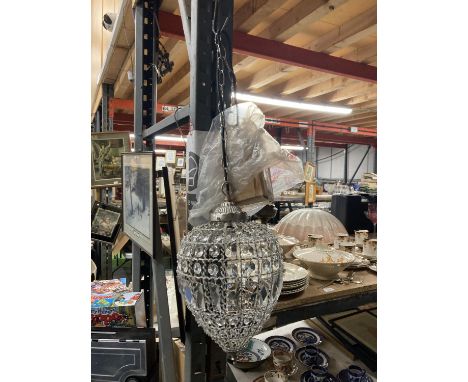 A TEARDROP LIGHT SHADE WITH CRYSTALS AND A CHAIN FITTING 