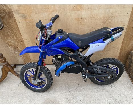 A CHILDS PETROL ENGINE MOTOR CROSS BIKE 