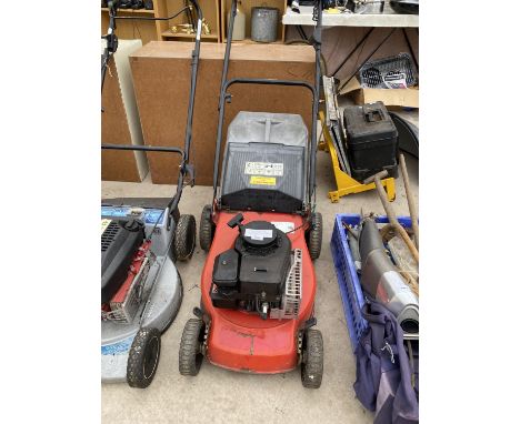 A PETROL ENGINE LAWN MOWER WITH GRASS BOX BELIEVED IN WORKING ORDER BUT NO WARRANTY 