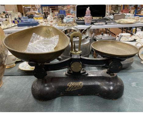 A SET OF VINTAGE 'BOOTS' CAST SCALES WITH BRASS PAN AND WEIGHTS 