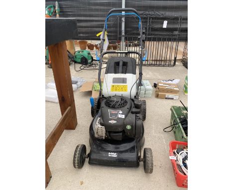 A PETROL MACALLISTER LAWN MOWER WITH A BRIGGS AND STRATTON ENGINE 