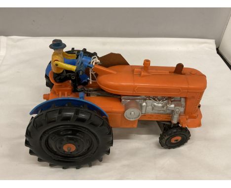 A BATTERY POWERED PLASTIC MODEL OF A VINTAGE TRACTOR 