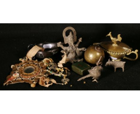 Group of Indian items including a spherical box, oil lamp, pot with domed cover with peacock surmount, relief decorated, a si