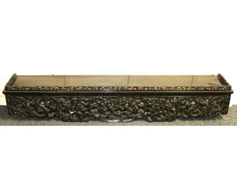 Chinese hardwood and pierced shelf top with painted peach and scrolling prunus frieze border, the deep apron well carved with