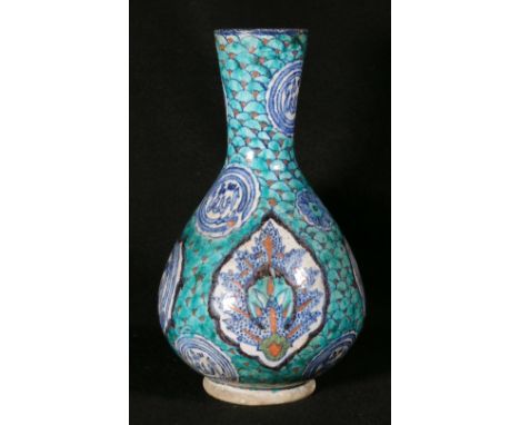 19th century Iznik vase of pear shape, the body decorated with calligraphic and floral panels on a green scale ground, 30cm C