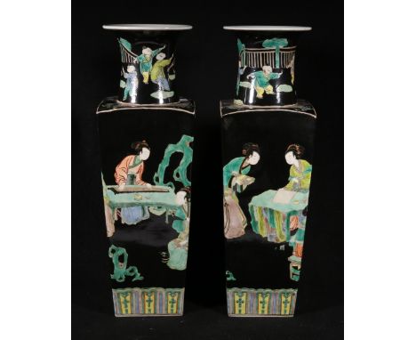 Pair of 19th century famille noir vases of square tapering form, decorated with female figures at ease and children, with a d