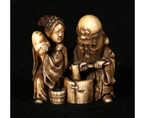 MASATOSHI, Japanese ivory netsuke depicting Fukurukuju pounding with a mallet, a female figure by his side, signed, 3.5cm, Me