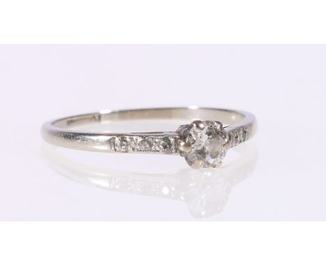 Diamond solitaire diamond ring, possibly platinum, with circular brilliant-cut stone measuring 4mm diameter, and diamond-set 