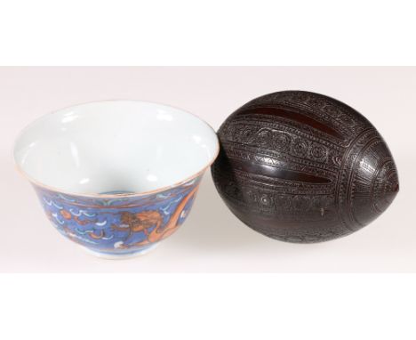 19th century Chinese dragon bowl, the blue ground decorated with dragons chasing the flaming pearl, Qianlong Zhuanshu mark to