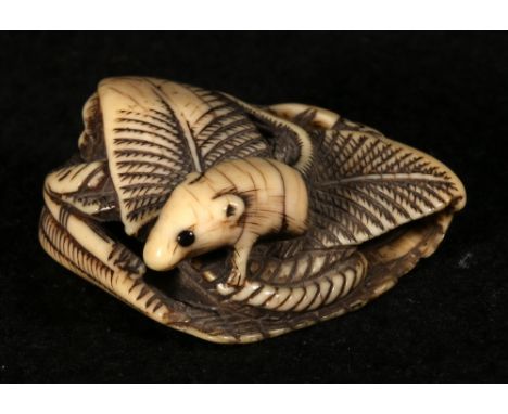 Japanese ivory netsuke depicting a rat seated on a basket filled with leaves, 4cm, Meiji CONDITION REPORT: Chip and missing s