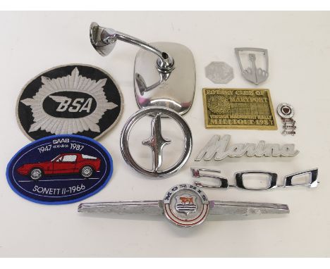 A box of badges to include a Morris badge, a Rotary Club of Maryport badge, a vintage rally badge and other items (Qty)