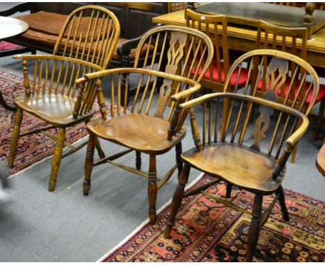 ^ An elm stick back Windsor chair, an open elm Windsor armchair and another (3)
