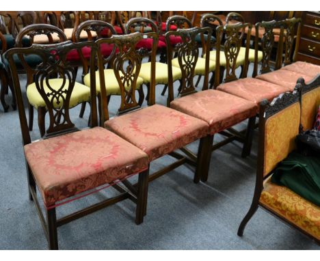 A set of six 19th century Chippendale style mahogany dining chairs, foliate carved pierced splats, overstuffed seats (6) 