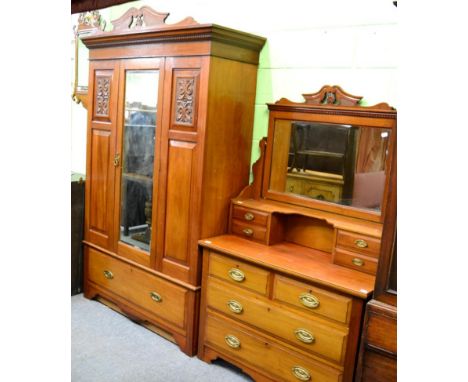 A two piece Edwardian bedroom suite comprising of a wardrobe and a dressing table 