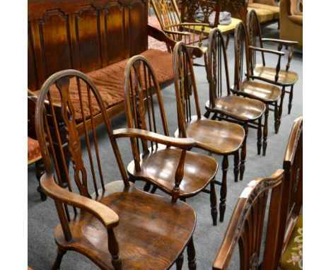 A set of six stick back elm Windsor chairs including two carvers 
