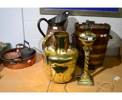 ^ A coopered oak harvest jug, a similar jardiniere, a large brass jug and a brass oil lamp