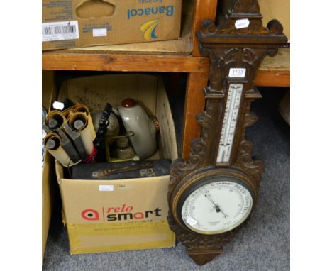 An oak barometer, three walking sticks, a bed pan, a fender, a mirror, a standard lamp, a table lamp, the pottery hot water b