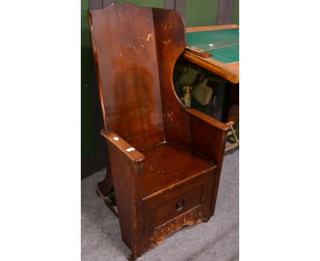 ^ A George III mahogany commode chair 