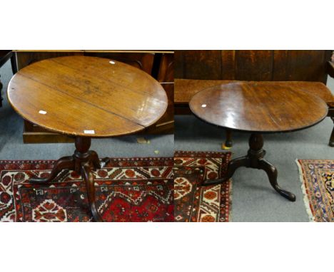 ^ Two George III oak tilt top tripod tables