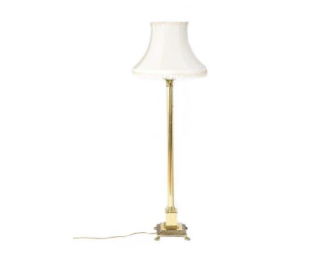 BRASS CORINTHIAN PILLAR STANDARD LAMP & SHADE. RAISED ON FOUR PAW FEET. HEIGHT: 67 INCHES.IN GOOD CONDITION.