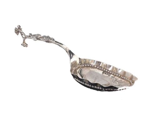 EMBOSSED CONTINENTAL SILVER CADDY SPOON WITH SCALLOPED RIM & EMBOSSED DUTCH SCENE WITH SCROLLED HANDLE. LENGTH: 5 INCHES.APPR