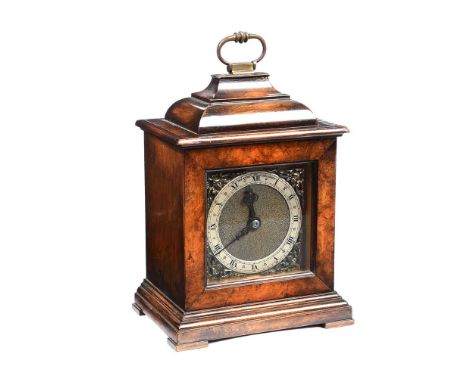 WALNUT CASED MANTEL CLOCK WITH A STEEL DIAL OF 4 X 3½ INCHES & BRASS SWING HANDLE. RAISED ON BRACKET FEET.JOHN WALK, SOUTH MO