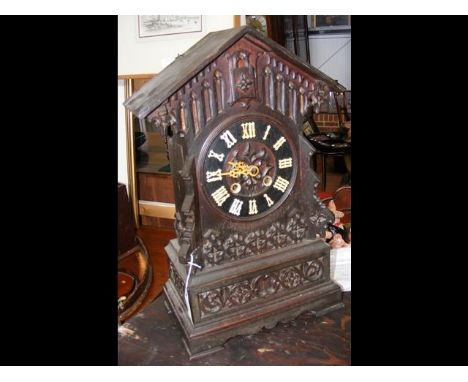 A 19th century carved Black Forest cuckoo clock - 47cm high 