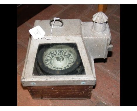A gimballed compass in case 