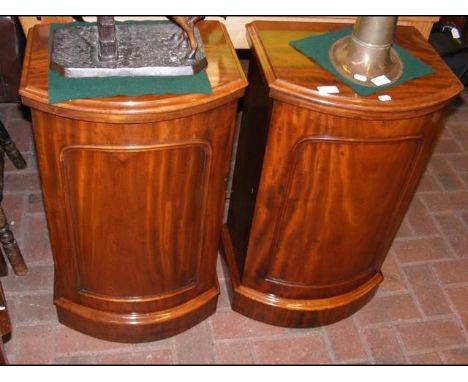 A pair of bow fronted mahogany bedside cabinets - 40cm wide 