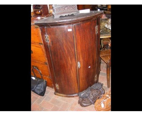 A Georgian bow front hanging wall cupboard CONDITION REPORTfew minor repairs as shown