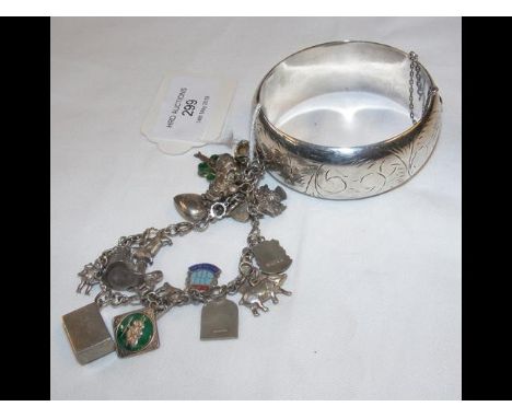 A silver bangle, together with silver charm bracelet 