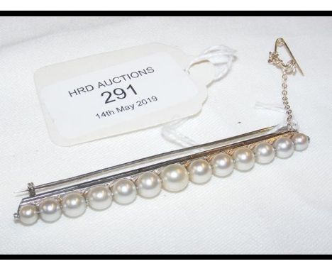 A lady's pearl bar brooch  set in 18ct white gold (tested)CONDITION REPORTseems ok18ct white gold tested not hall marked that