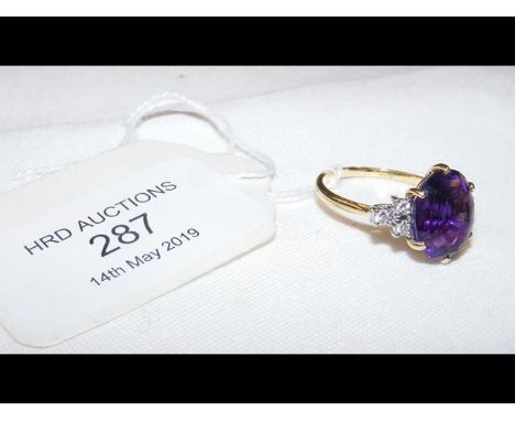 An 18ct gold amethyst and diamond ring 