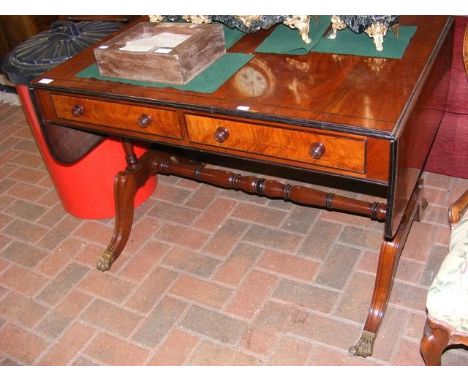 A Regency mahogany sofa table on swept supports - 50cm x 70cm 