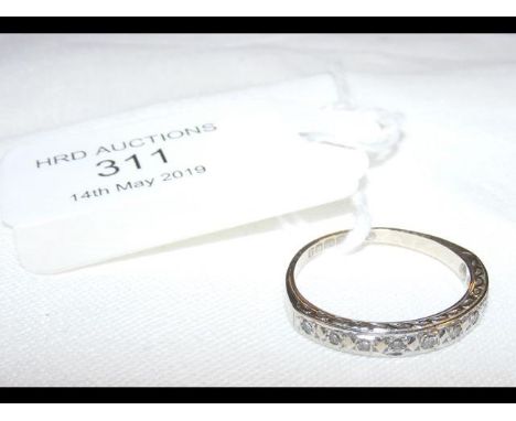 An 18ct white gold diamond half eternity ring 