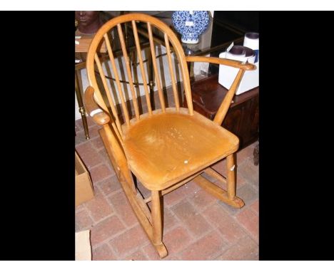 A small Ercol child's rocking chair 