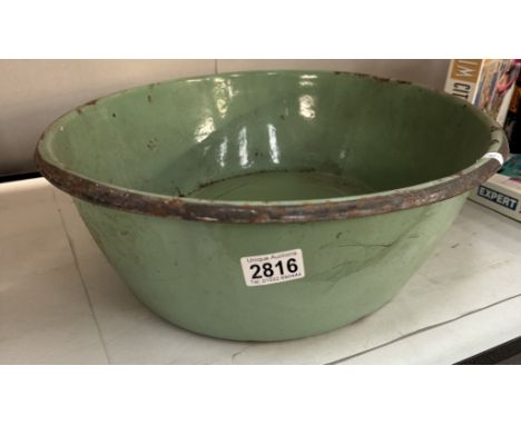 A vintage green enamel wash basin