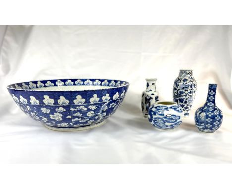 A large Chinese blue and white bowl with floral decoration, ribbed, seal mark to base, diameter 40cm, four Chinese blue and w