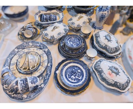 A selection of 19th century and later blue and white dinner ware, including tureens, dinner plates, large meat platter etc.